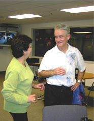 A couple having fun at a social mixer at the Enfield Tennis Club