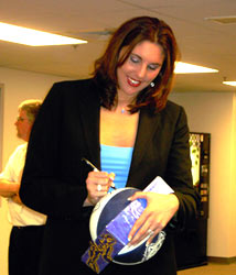 Former UConn star and professional 
			basketball player, Kara Wolters, signing autographs for fans at the 
			Enfield Tennis Club