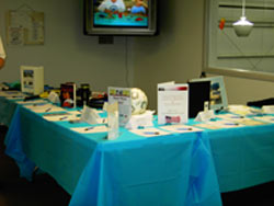 A silent auction table for a community benefit at the Enfield Tennis Club
